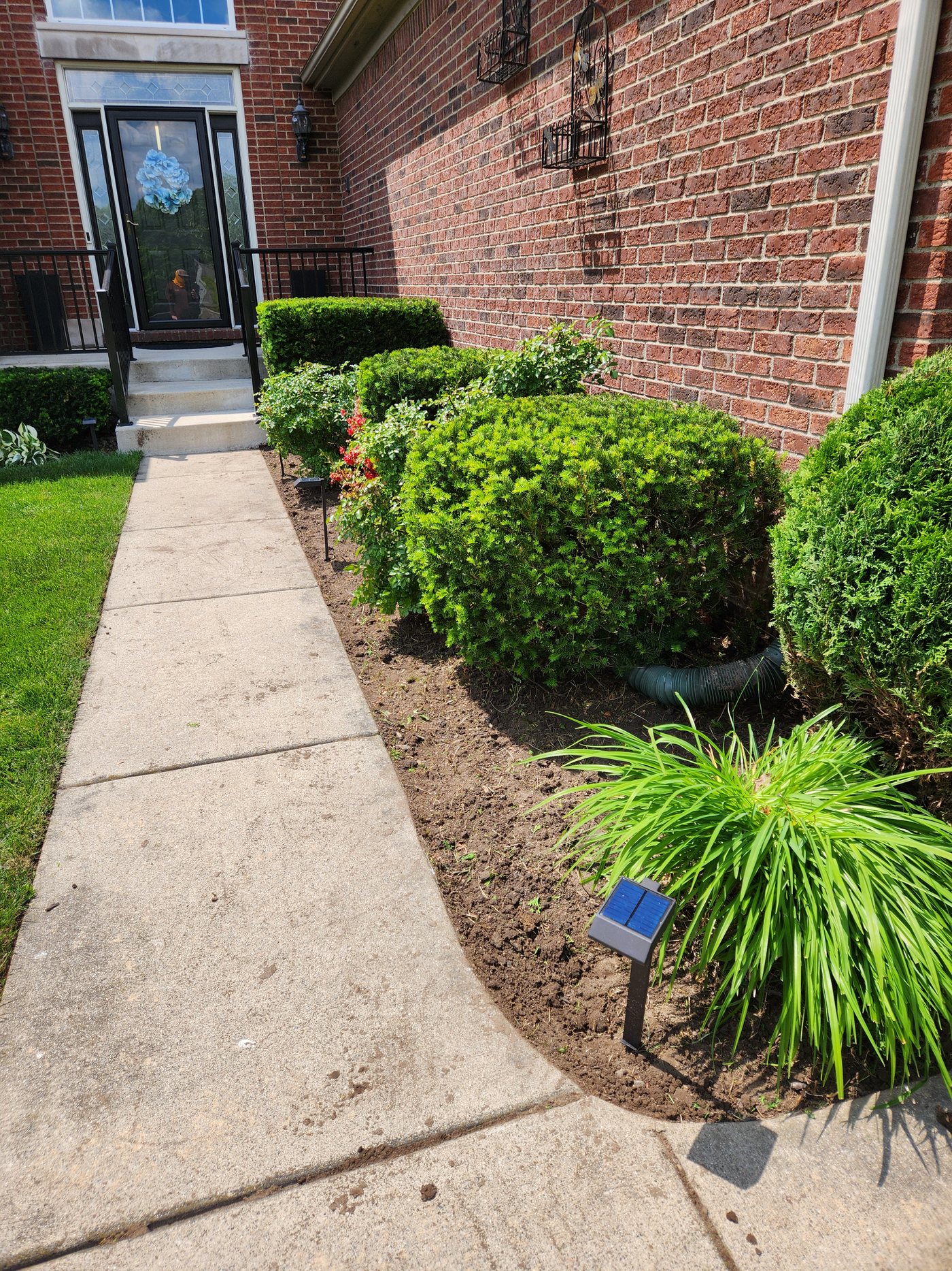 Cleaned front landscape bed after Stellar Lawn Care work
